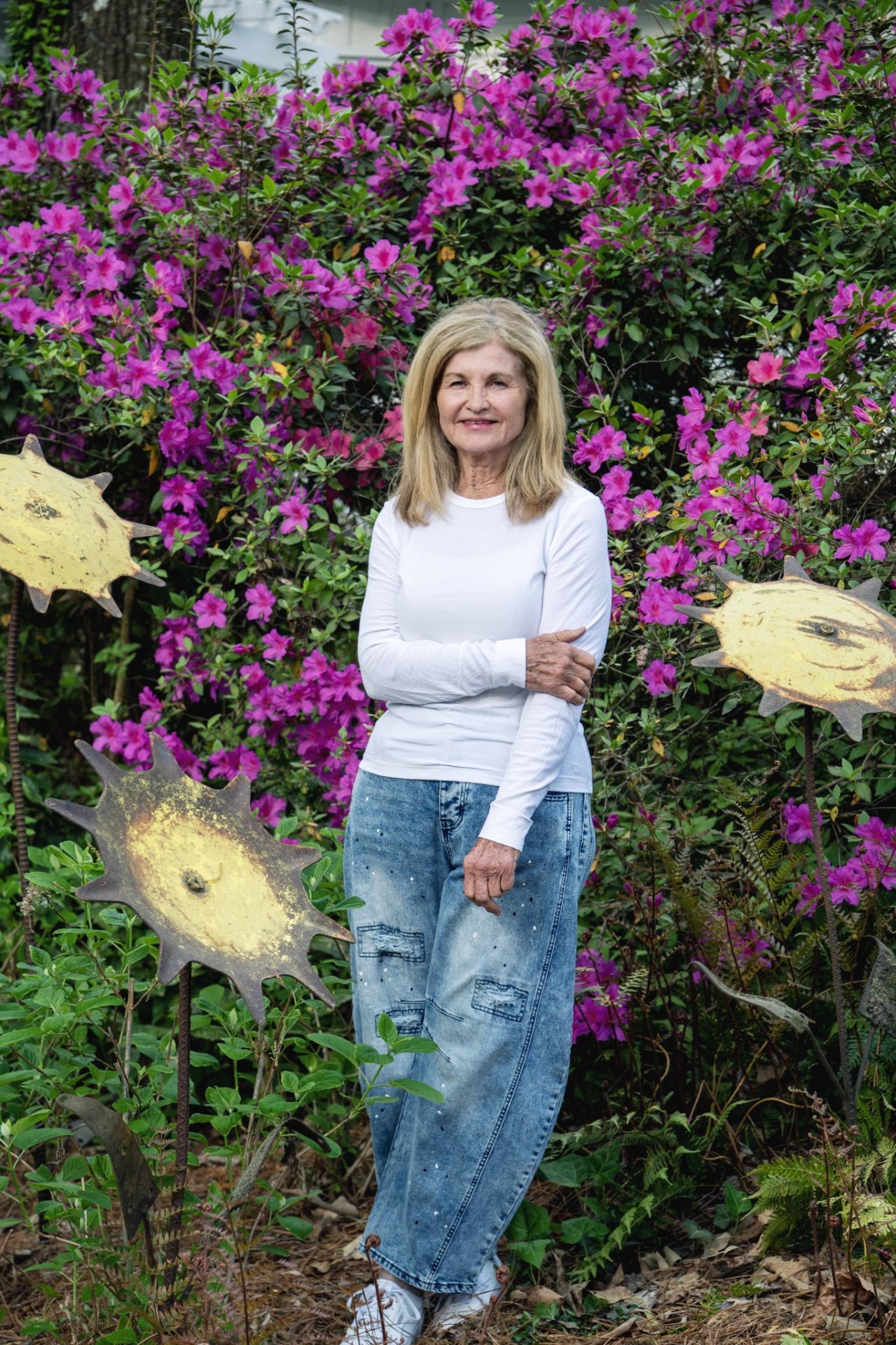 Debbie in her garden holding flowers