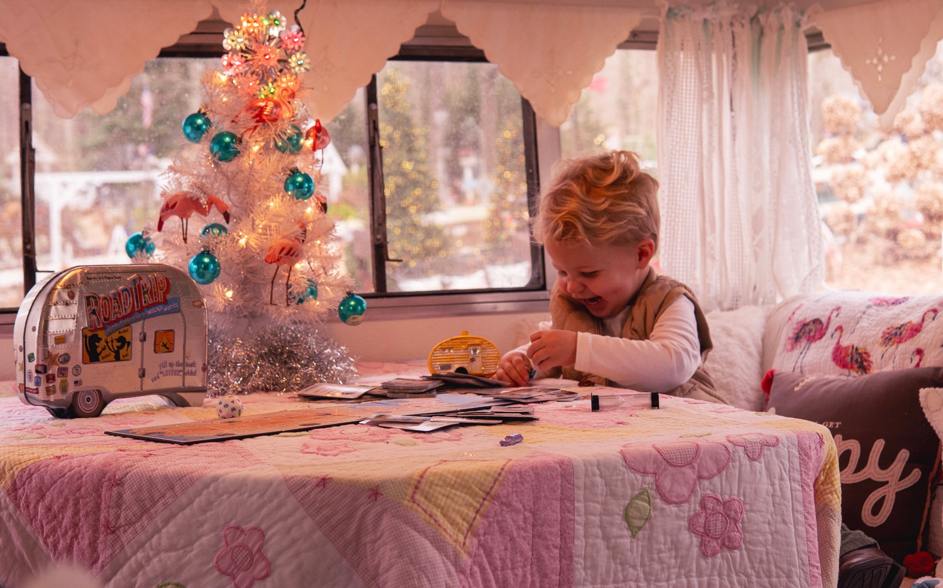 Toddler playing inside the vintage camper
