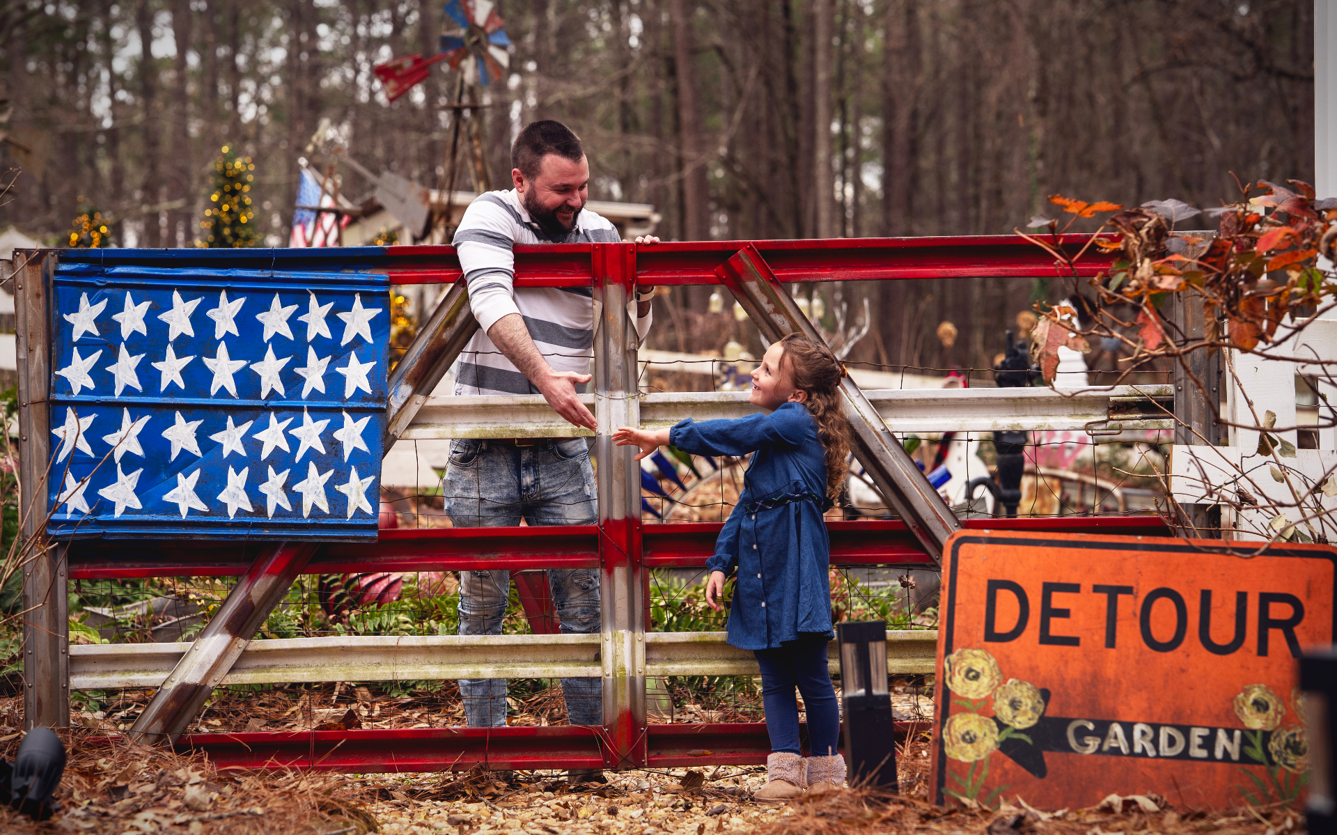 Dad and daughter at the garden gate