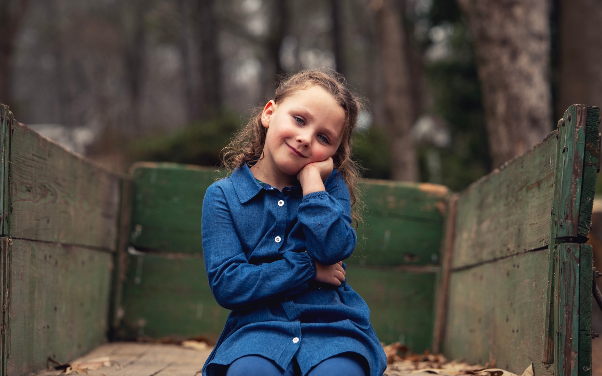 Girl sitting in the green wagon