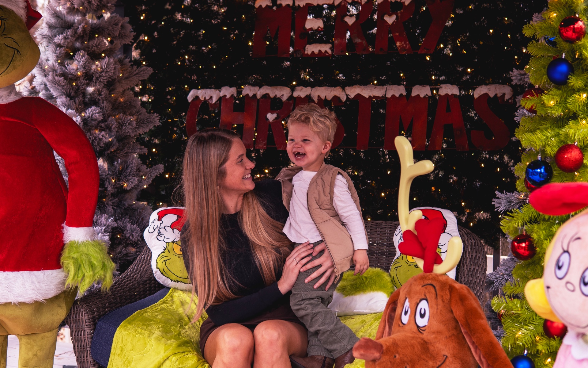Mom and son laughing at Grinch setup