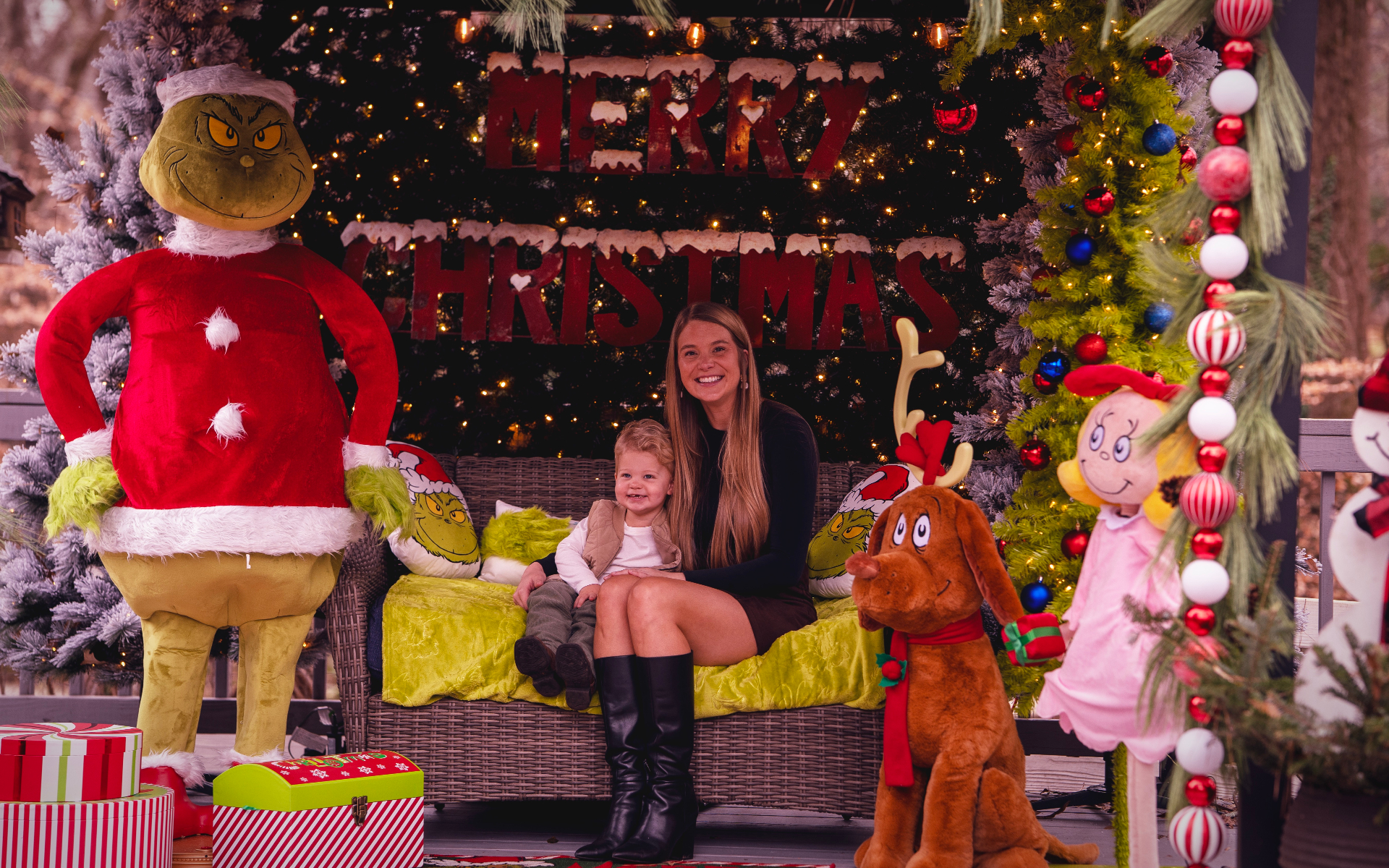 Mom and son at the Grinch Christmas setup