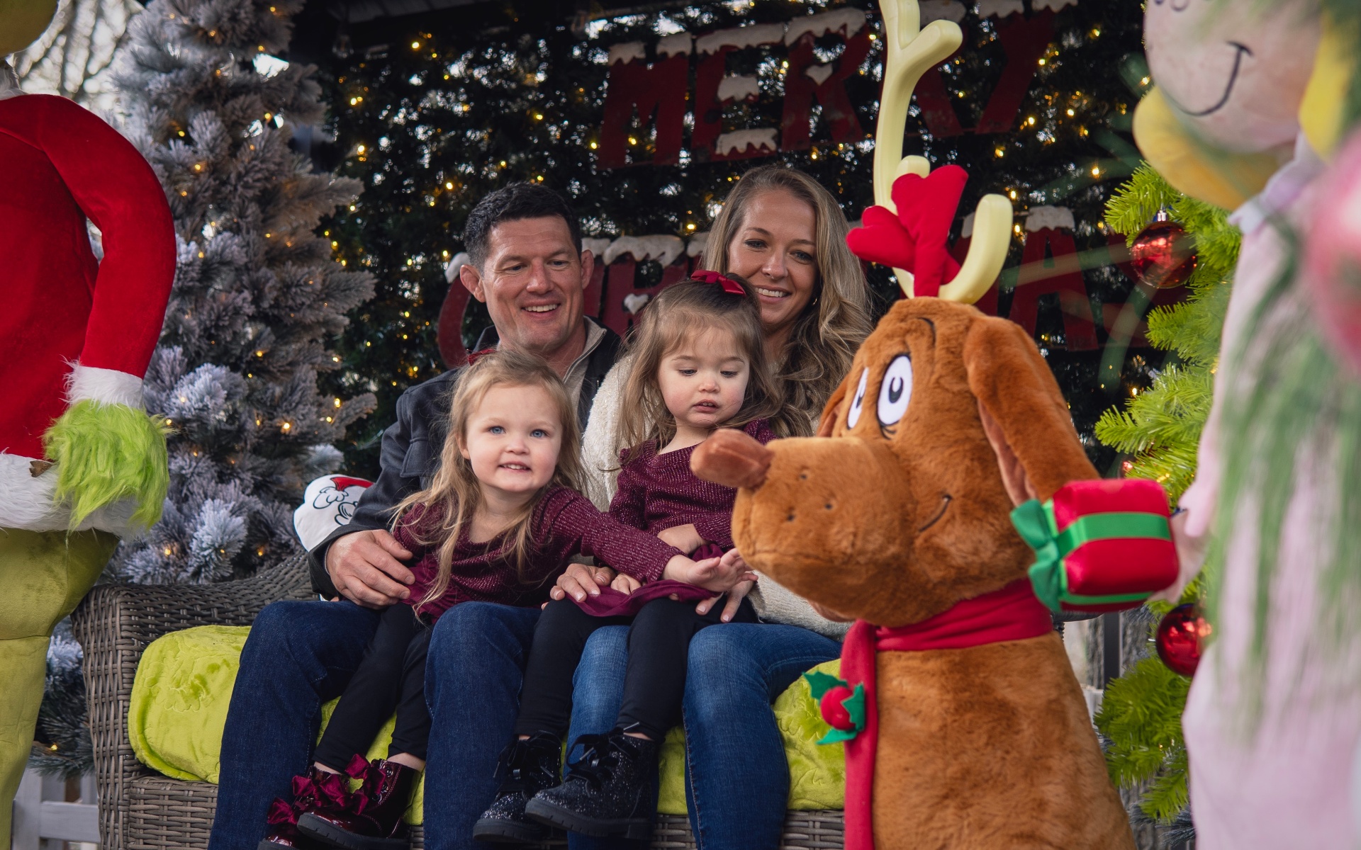 Family at the Grinch Christmas setup