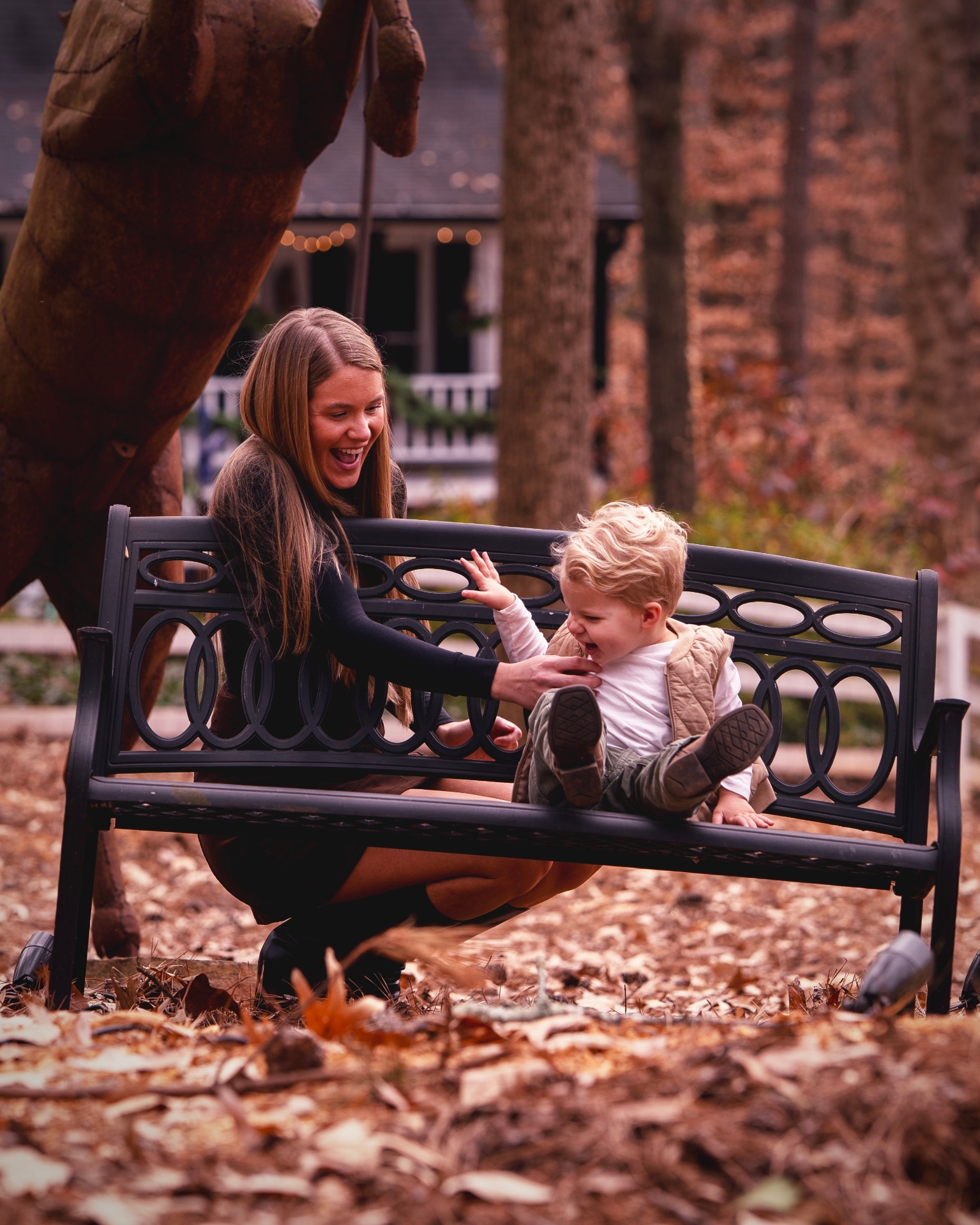 Mom and toddler playing on a bench