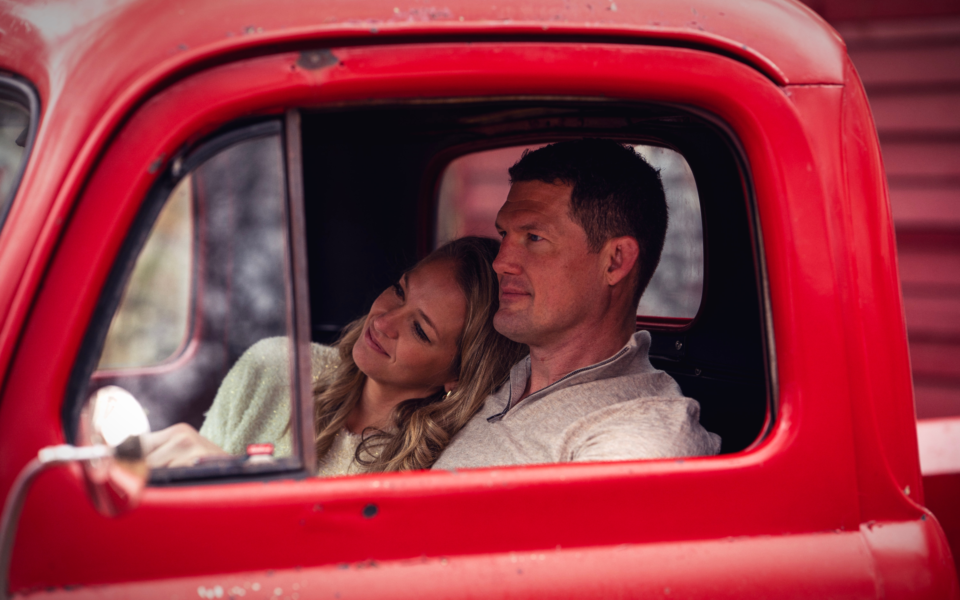 Couple in the vintage red truck