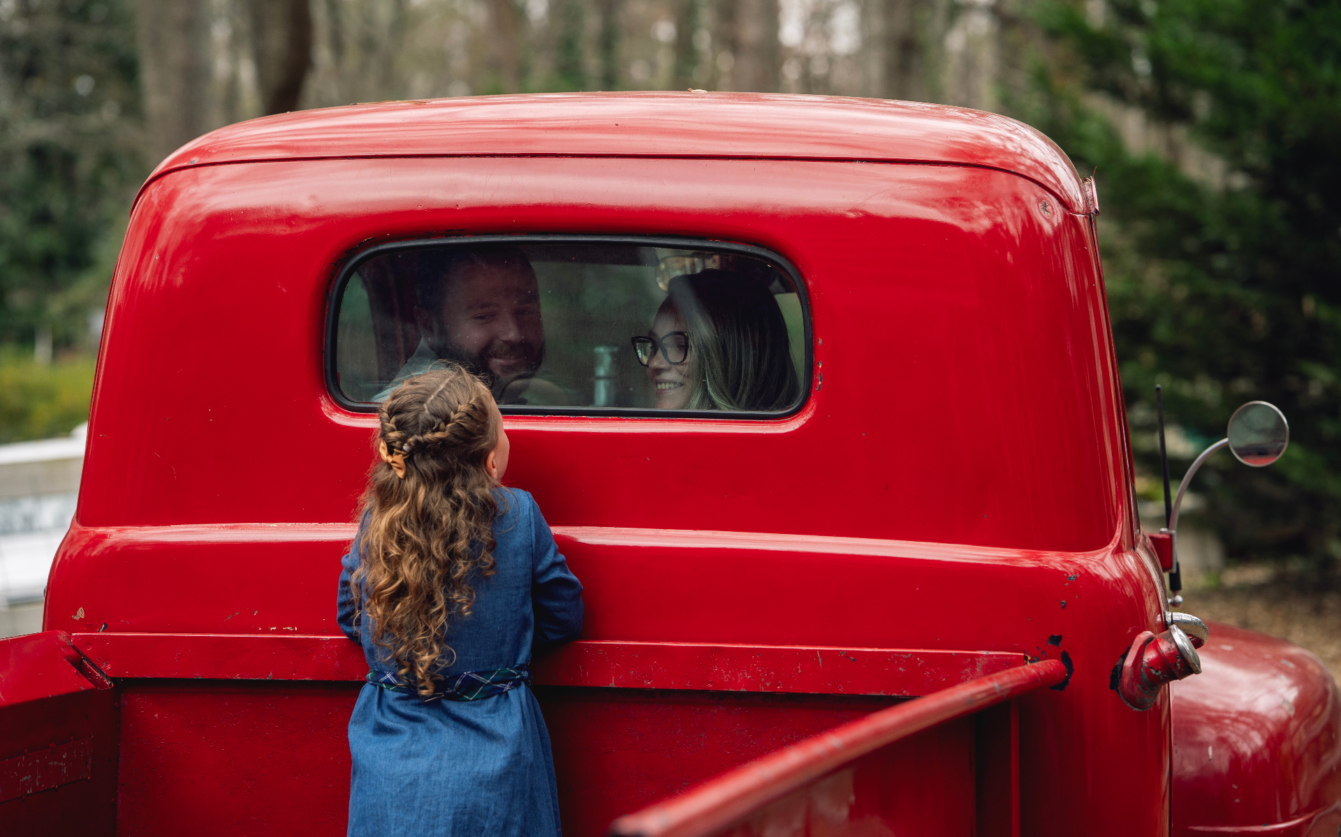 Girl peeking through the truck window